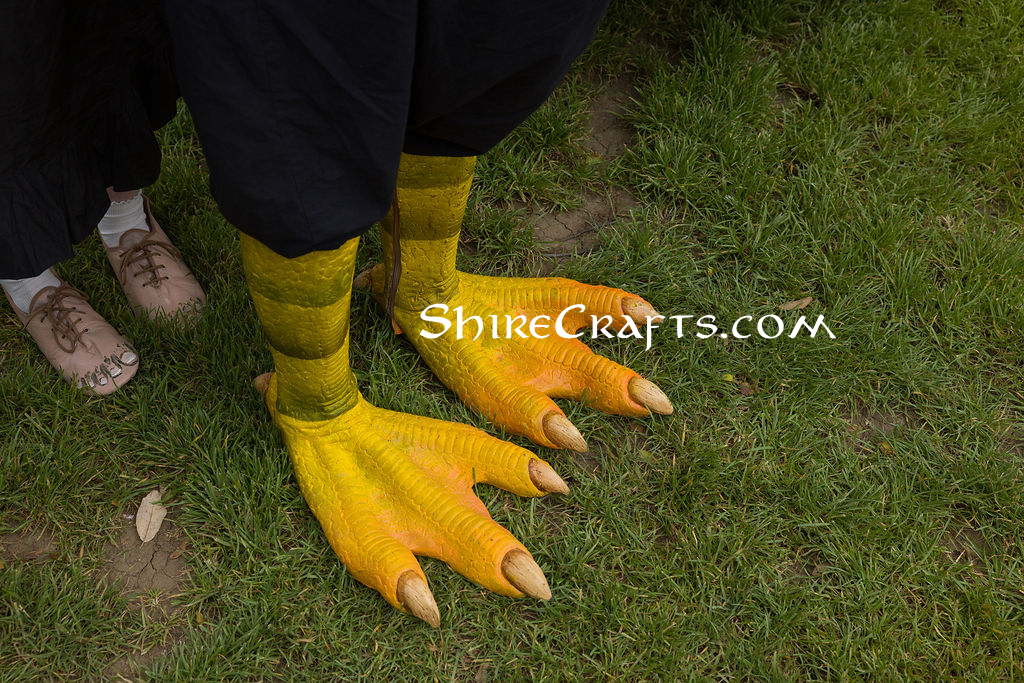 Silicon dragon feet and shoes painted like hobbit feet.