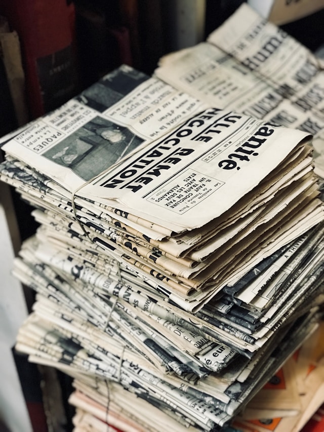 Picture of a stack of newspapers by Fabien Barral